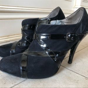 Guess Black suede and patent leather booties.